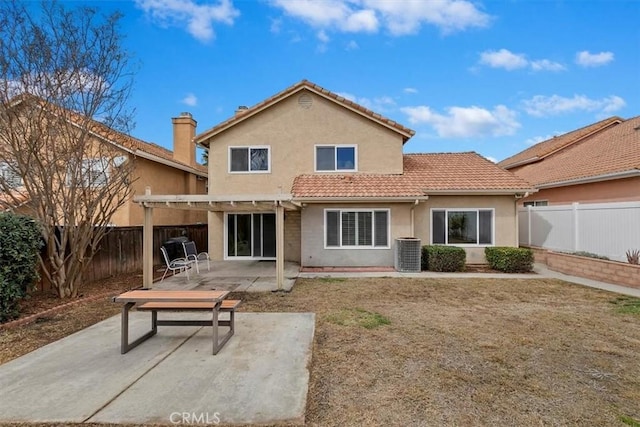 rear view of house featuring a patio, central AC unit, and a pergola