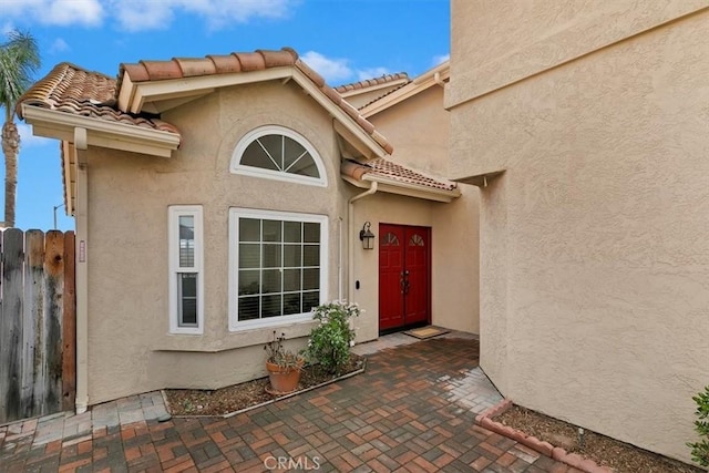 doorway to property with a patio area