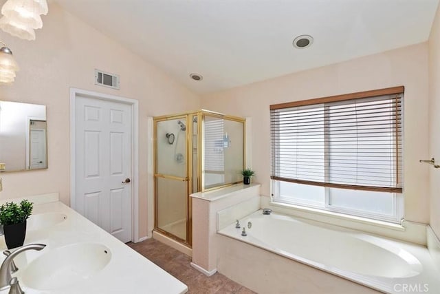 bathroom with vanity, separate shower and tub, and lofted ceiling