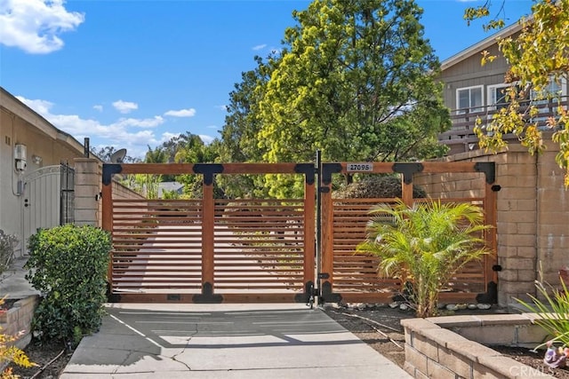 view of gate with fence