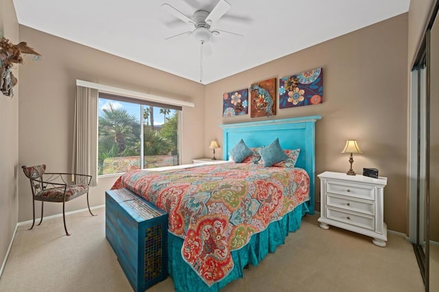 carpeted bedroom featuring ceiling fan