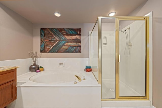 bathroom with vanity and plus walk in shower