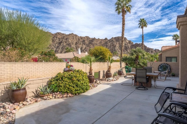 view of patio / terrace featuring a mountain view