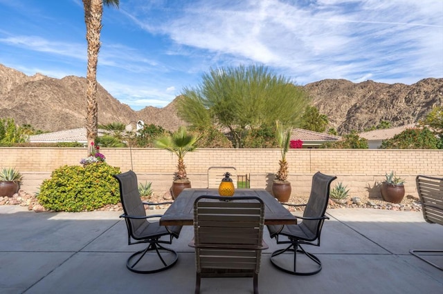 view of patio / terrace with a mountain view