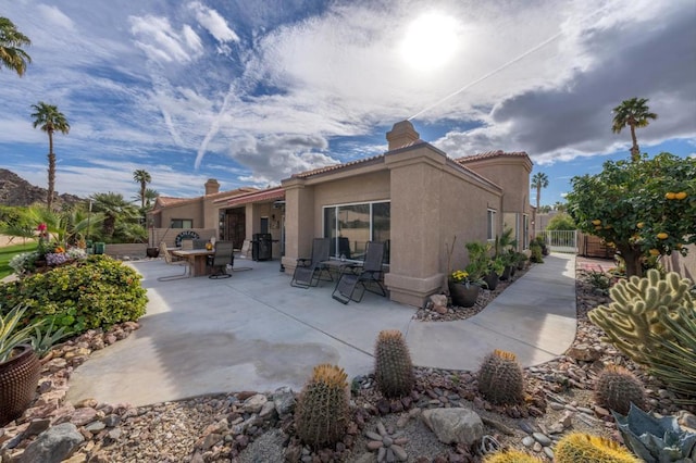 rear view of house featuring a patio area