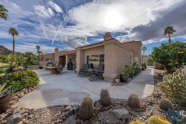 rear view of house with a patio area