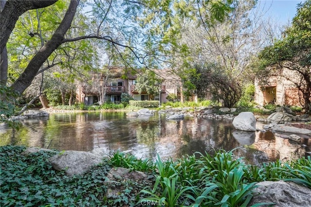 exterior space with a water view