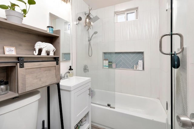 full bathroom with vanity, shower / bath combination with glass door, and toilet