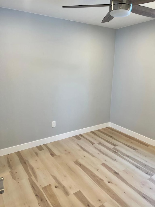 spare room featuring ceiling fan and light hardwood / wood-style flooring