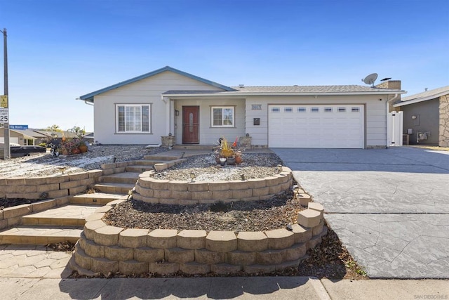 single story home featuring a garage