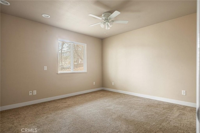 carpeted empty room with ceiling fan