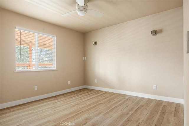 spare room with ceiling fan and light hardwood / wood-style floors