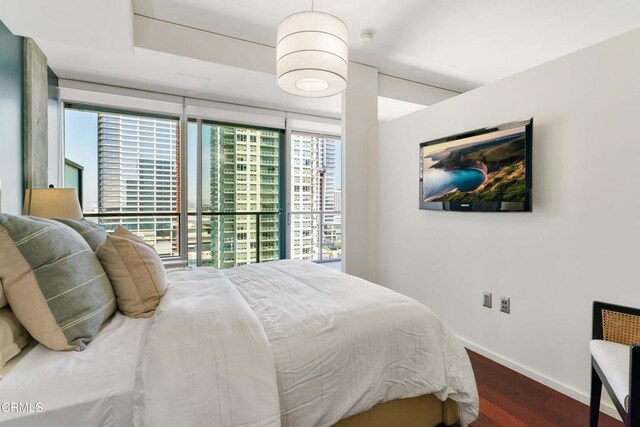 bedroom featuring dark wood-type flooring