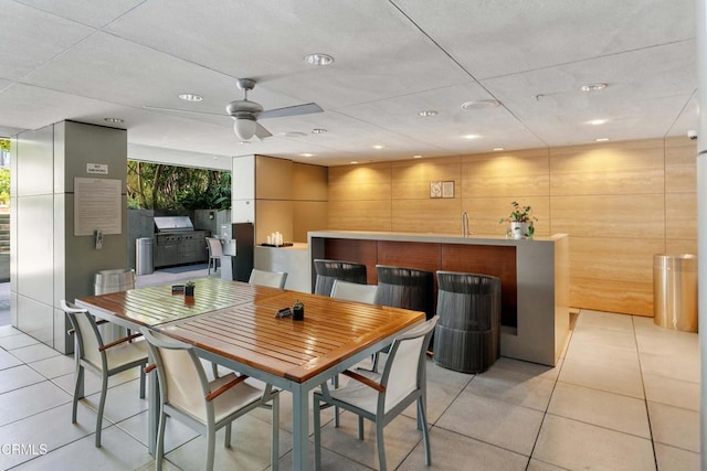 interior space with indoor bar and ceiling fan