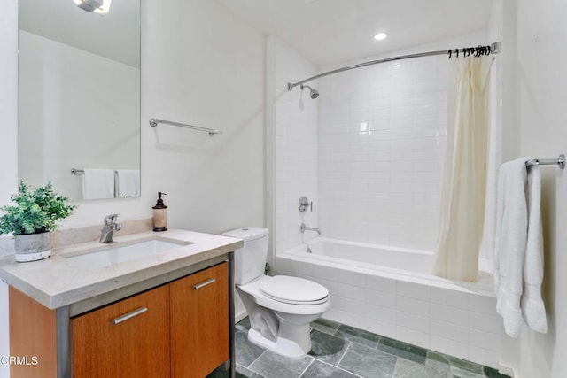 full bathroom with shower / tub combo with curtain, vanity, and toilet