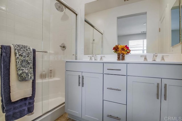 bathroom featuring vanity and walk in shower