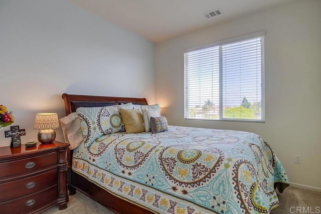 bedroom featuring light colored carpet