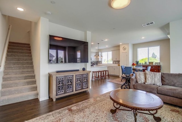 living room with dark hardwood / wood-style floors