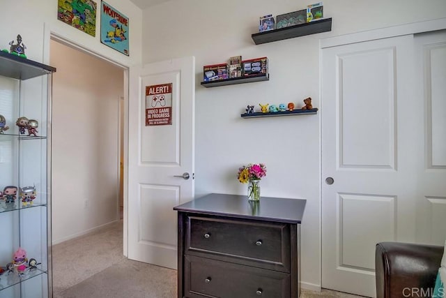 hallway with light carpet