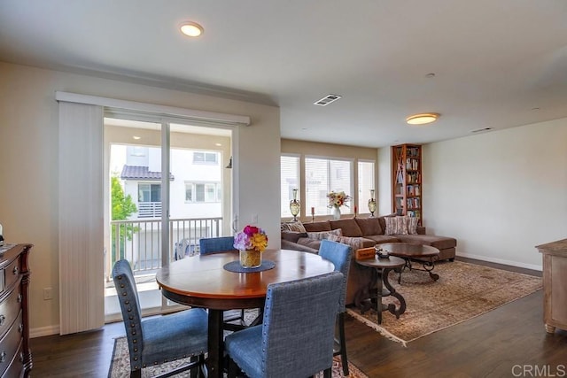 dining area with dark hardwood / wood-style floors