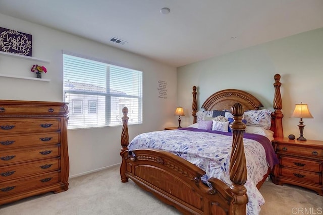 bedroom featuring light colored carpet