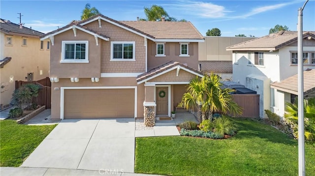 view of front of property with a garage and a front lawn