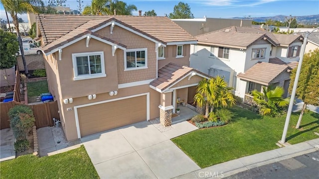 view of front of home with a garage and a front yard