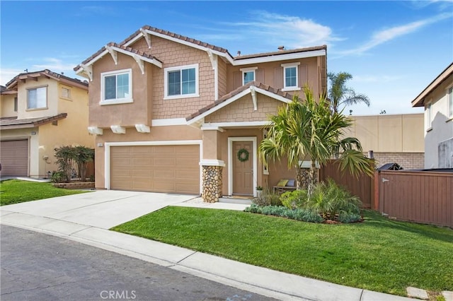 craftsman house featuring a garage and a front lawn