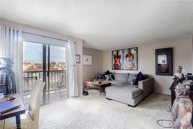 carpeted living room featuring a textured ceiling