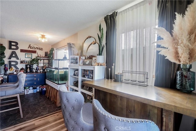 interior space with hardwood / wood-style flooring and a textured ceiling