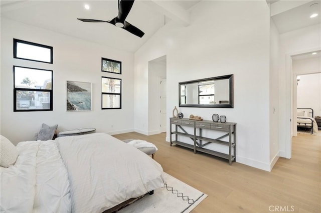 bedroom featuring beamed ceiling, ceiling fan, high vaulted ceiling, and light hardwood / wood-style flooring