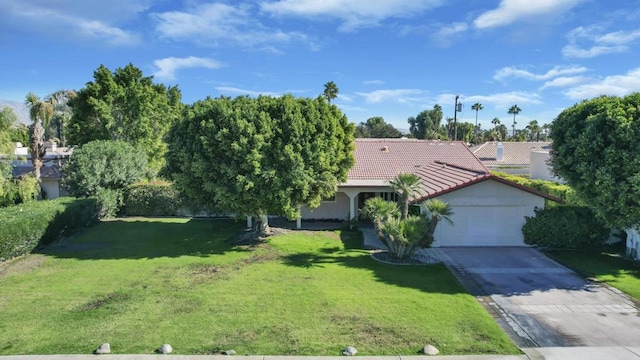 view of front of property with a garage and a front yard