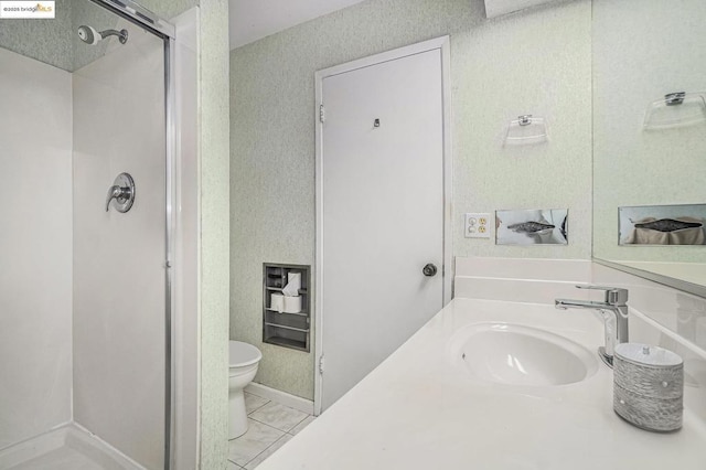 bathroom with vanity, toilet, and walk in shower