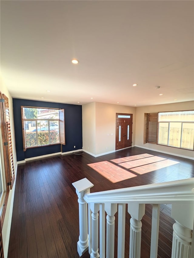 entryway featuring dark wood finished floors, recessed lighting, and baseboards