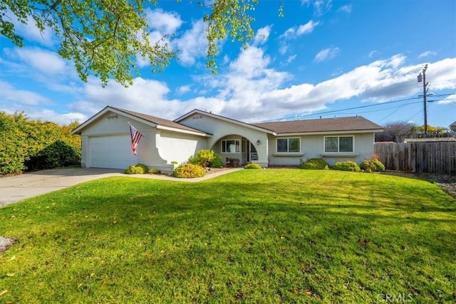 single story home featuring a garage and a front yard