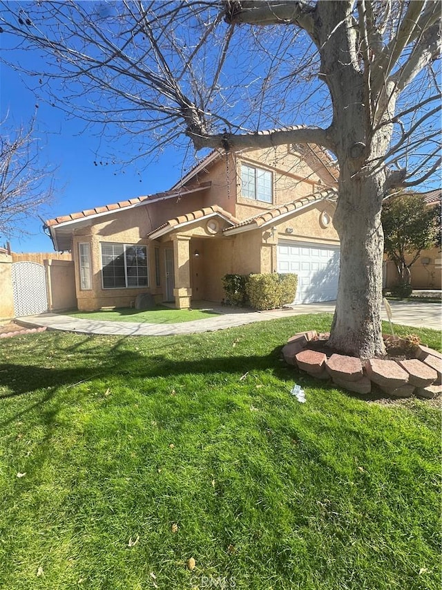 view of front of property with a garage and a front lawn