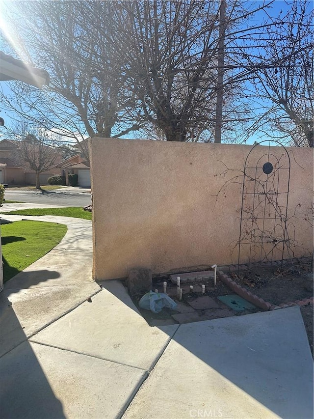 view of side of home with a patio