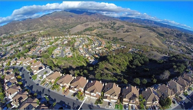 birds eye view of property with a mountain view