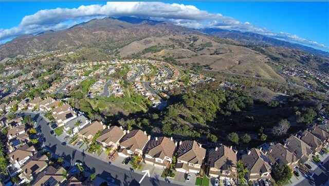 birds eye view of property featuring a mountain view