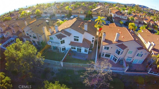 birds eye view of property with a residential view