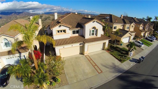 mediterranean / spanish-style house featuring a garage