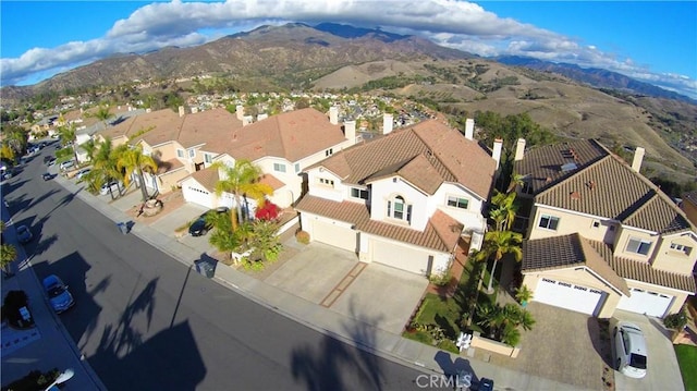 bird's eye view featuring a mountain view and a residential view