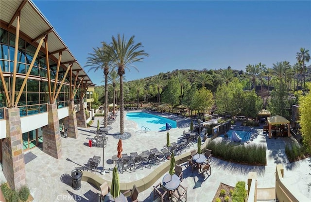 community pool with a patio area