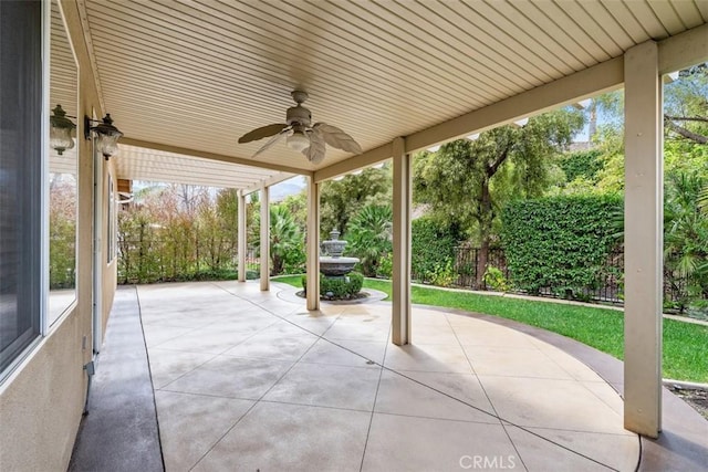 view of patio / terrace featuring a ceiling fan and fence