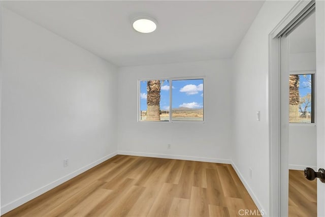 empty room with light hardwood / wood-style floors