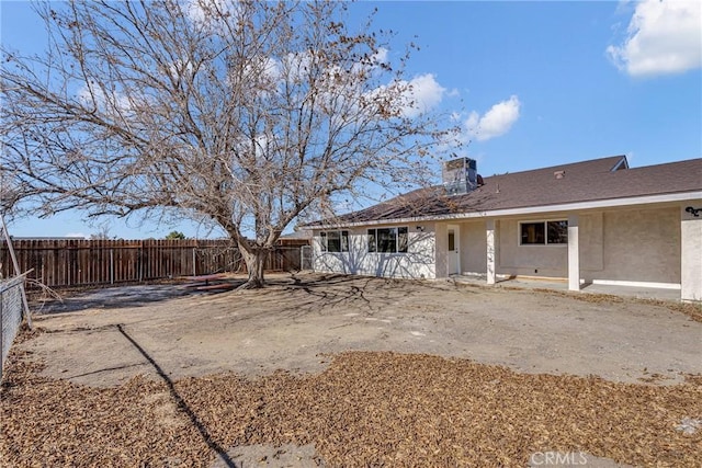 rear view of house featuring a patio