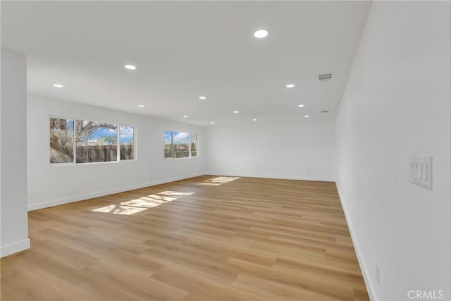 unfurnished room featuring light wood-type flooring