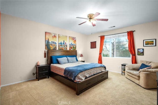 bedroom featuring light carpet and ceiling fan