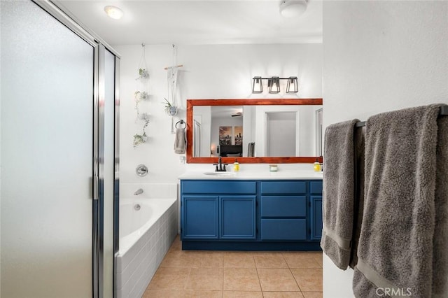 bathroom featuring tile patterned flooring, vanity, and independent shower and bath