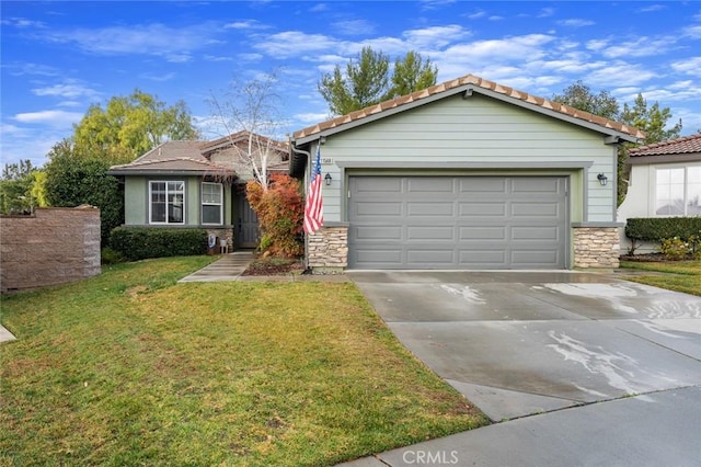 view of front of home featuring a garage and a front lawn